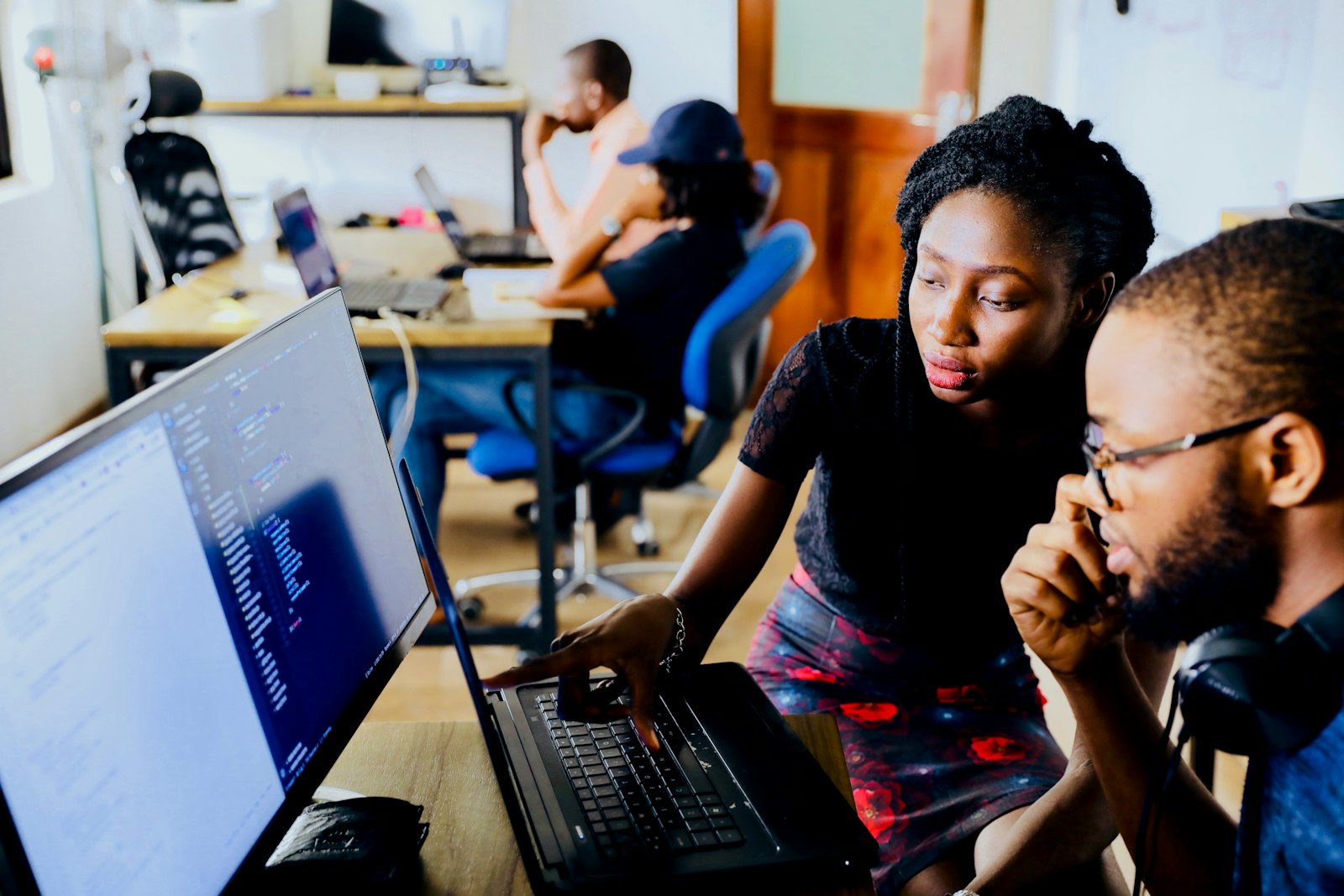 Two XITERIX engineers reviewing code together